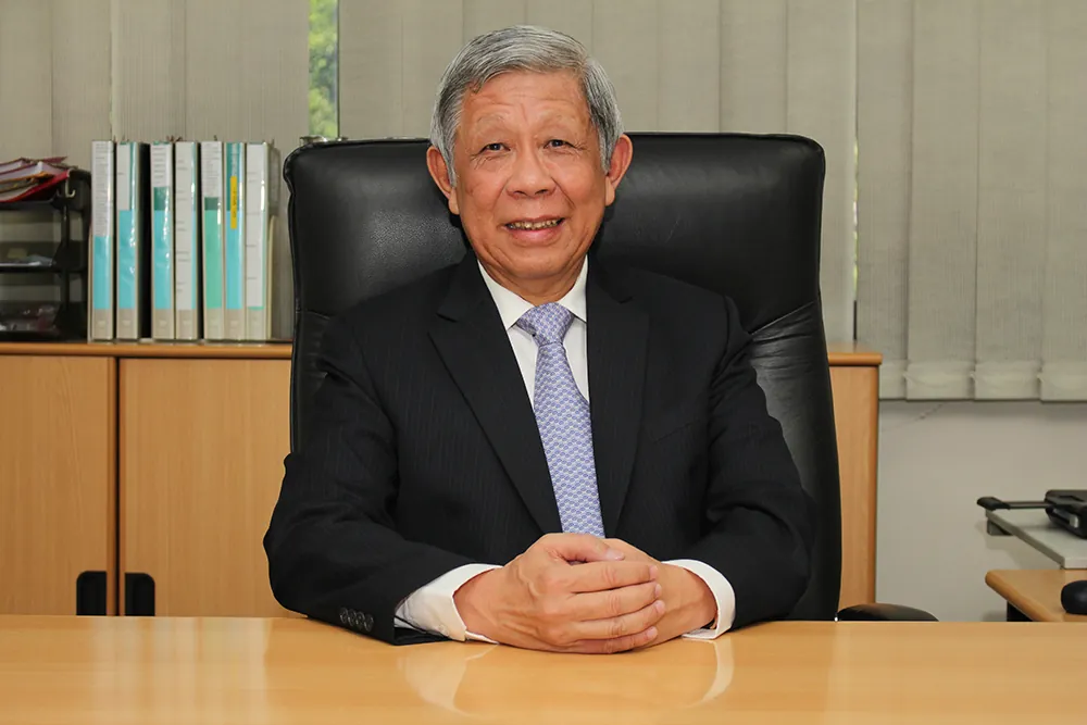 Mr Peh Lam Hoh at his desk